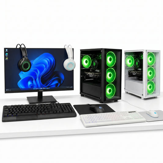 Computer setup with monitor, keyboard, and two gaming PC cases on a white surface